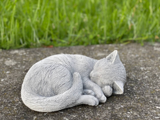 Concrete laying cat figurine