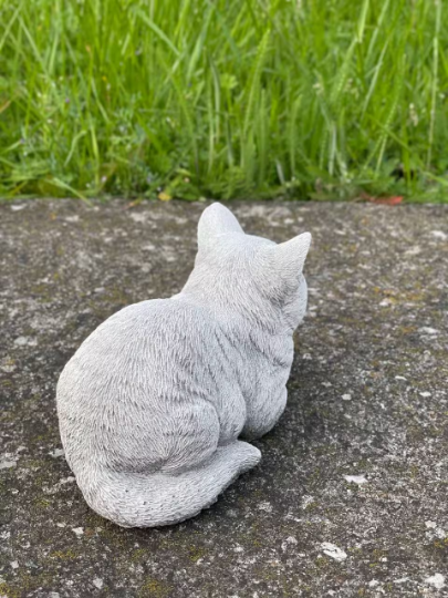 Resting concrete cat statue