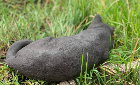 Sleeping cat concrete statue