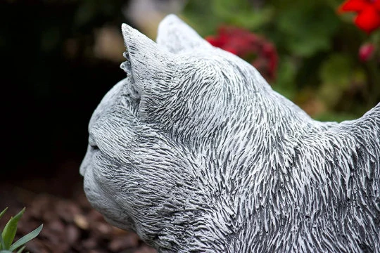 Cat sleeping concrete statue