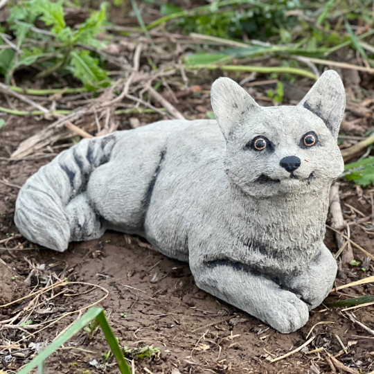 Lying concrete cat figurine