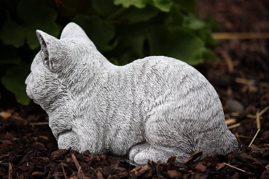 Sleeping curled up cat statue