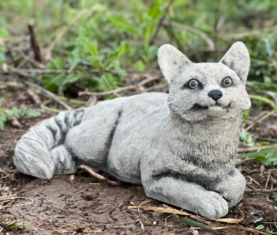 Lying concrete cat figurine