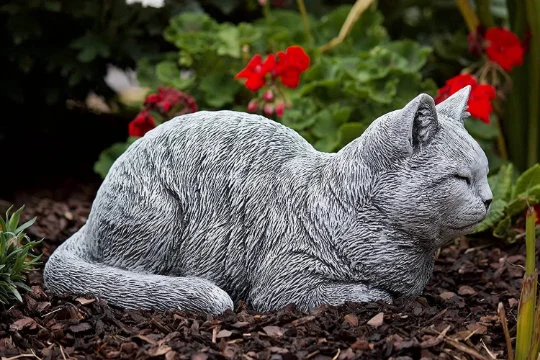 Cat sleeping concrete statue