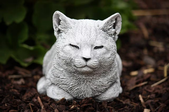 Sleeping curled up cat statue