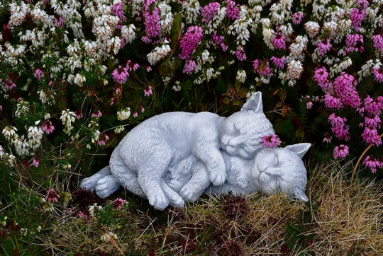 Two sleeping cats statue