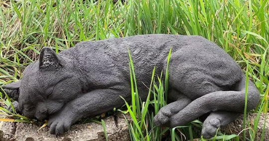 Sleeping cat concrete statue