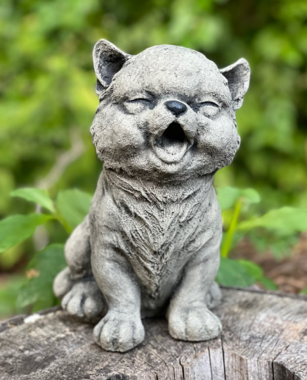 Smilling sitting cat figurine