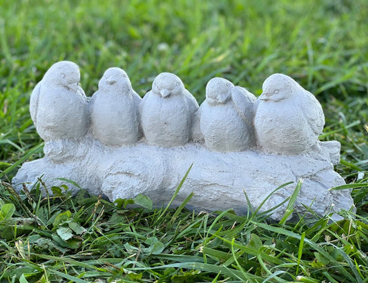 Five birds sitting on stump figurine