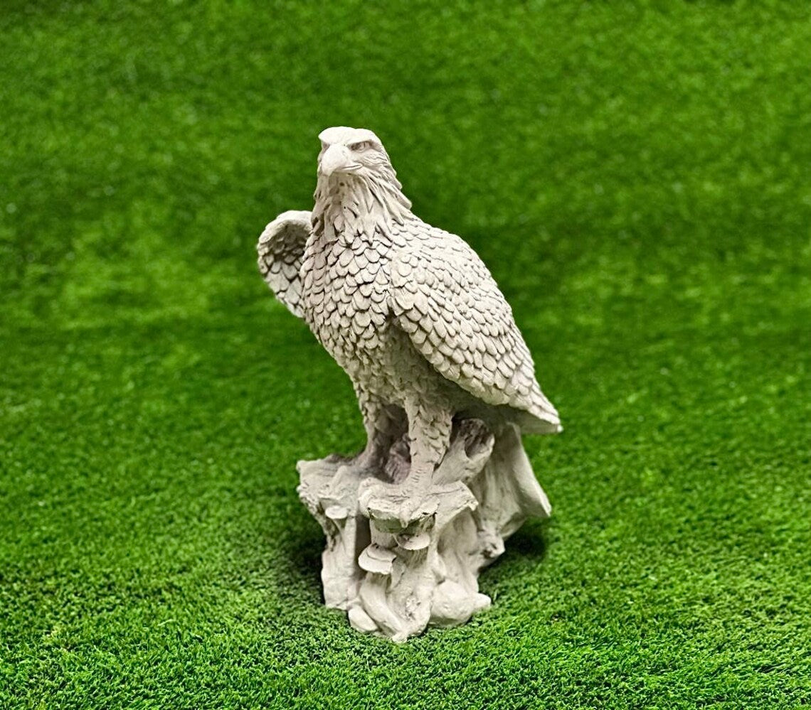 Eagle sitting on stump figure