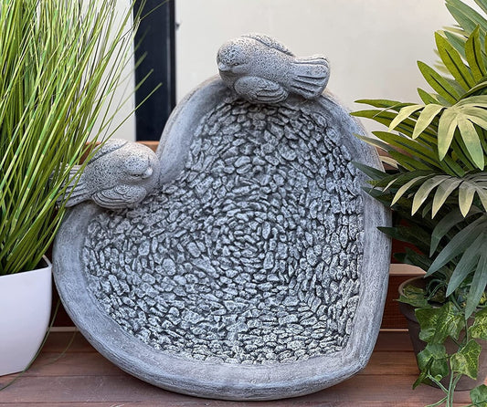 Water drinker with birds sculpture