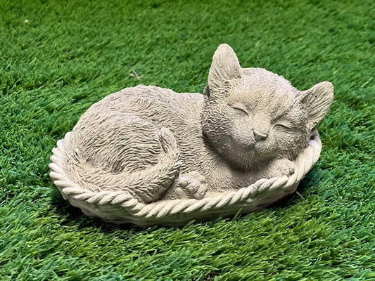 Sleeping cat in basket statue