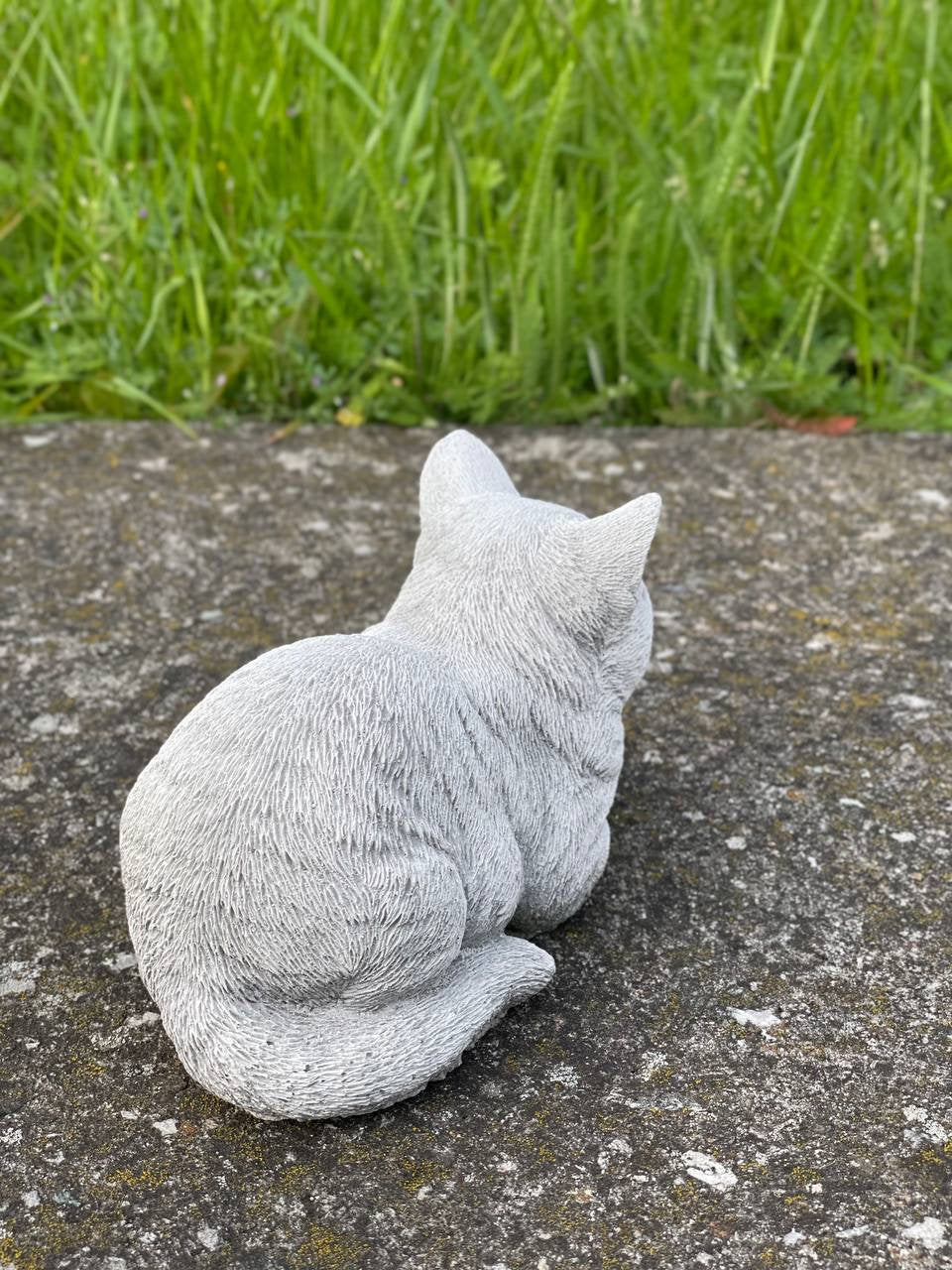Resting cat statue