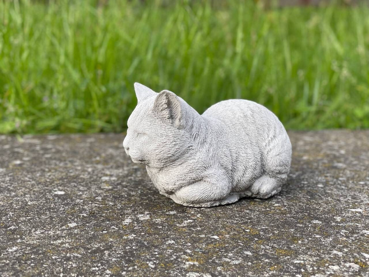 Resting cat statue