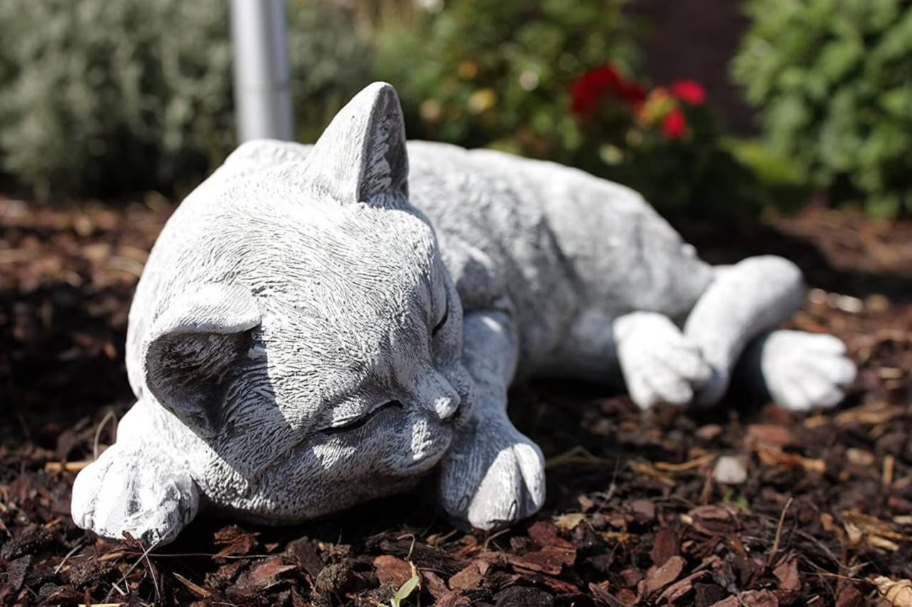 Resting kitty garden statue