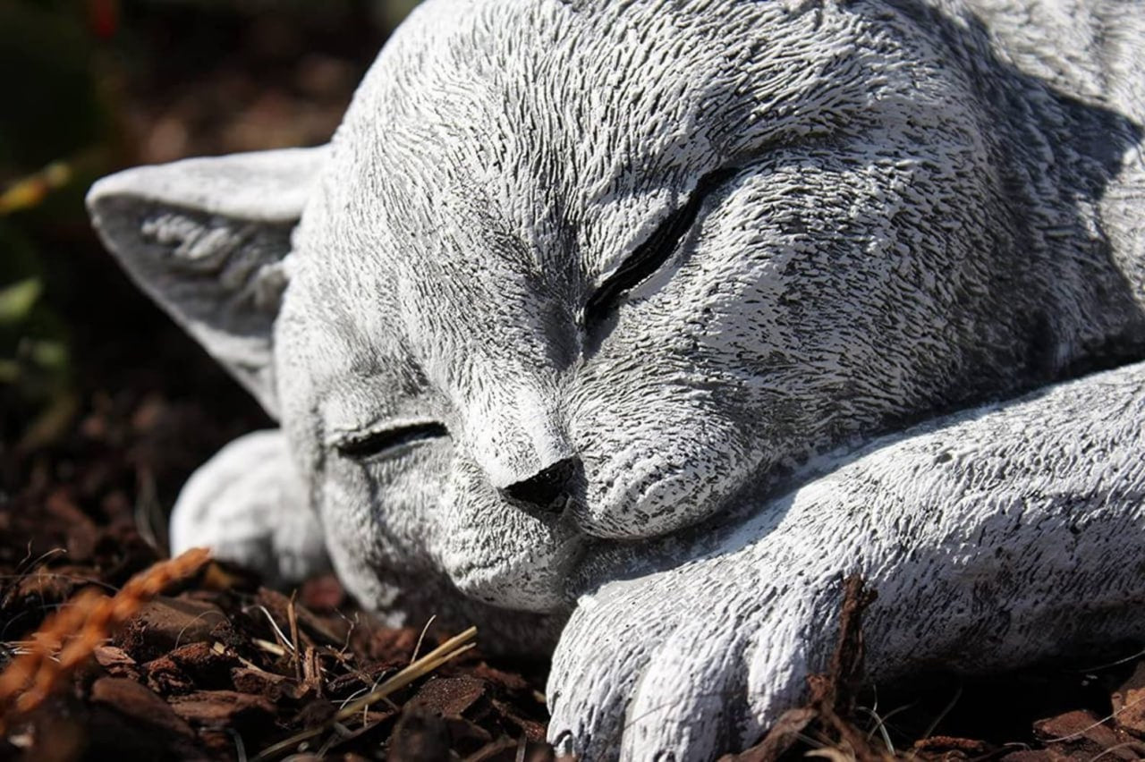 Resting kitty garden statue